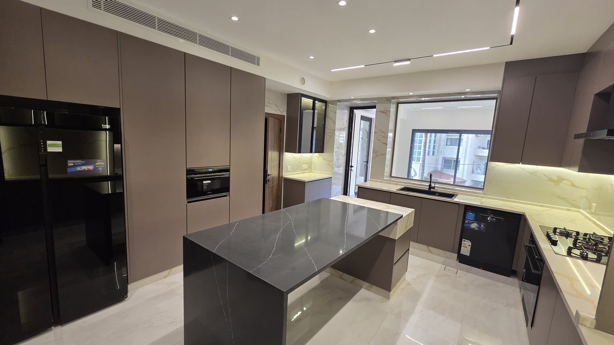 Residence 102 — Kitchen from entrance corner