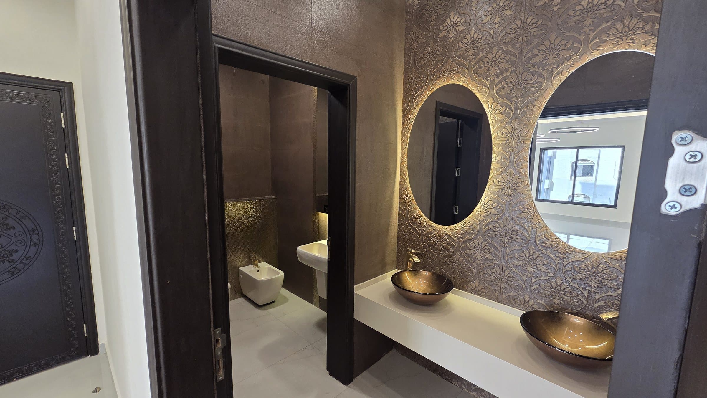Residence 201 — Guest bathroom and powder room