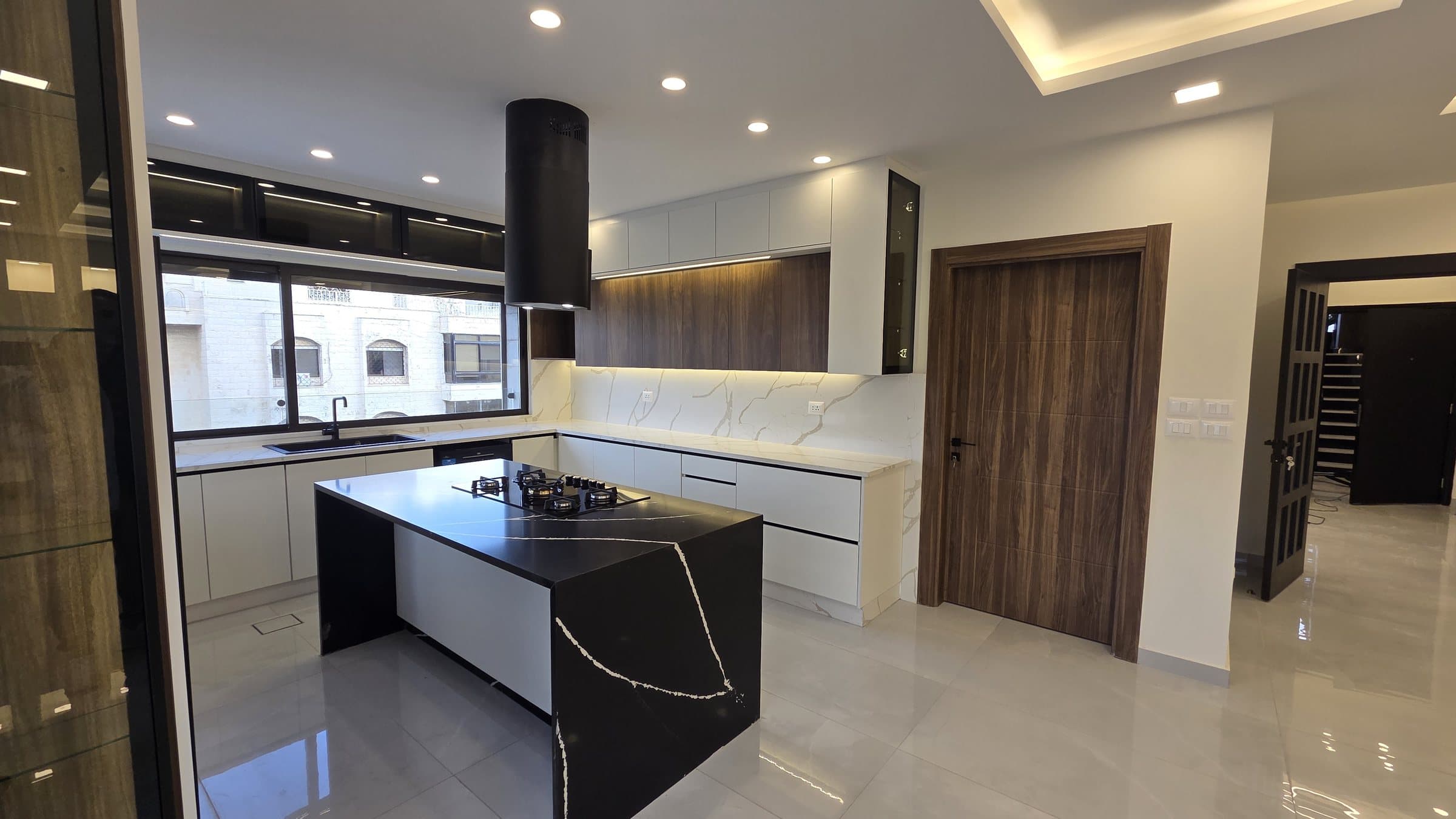 Residence 201 — Kitchen and door to laundry and maid room