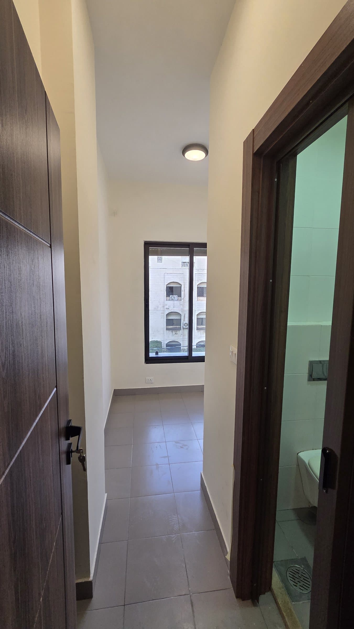 Residence 201 — Maid Room entrance and Bathroom
